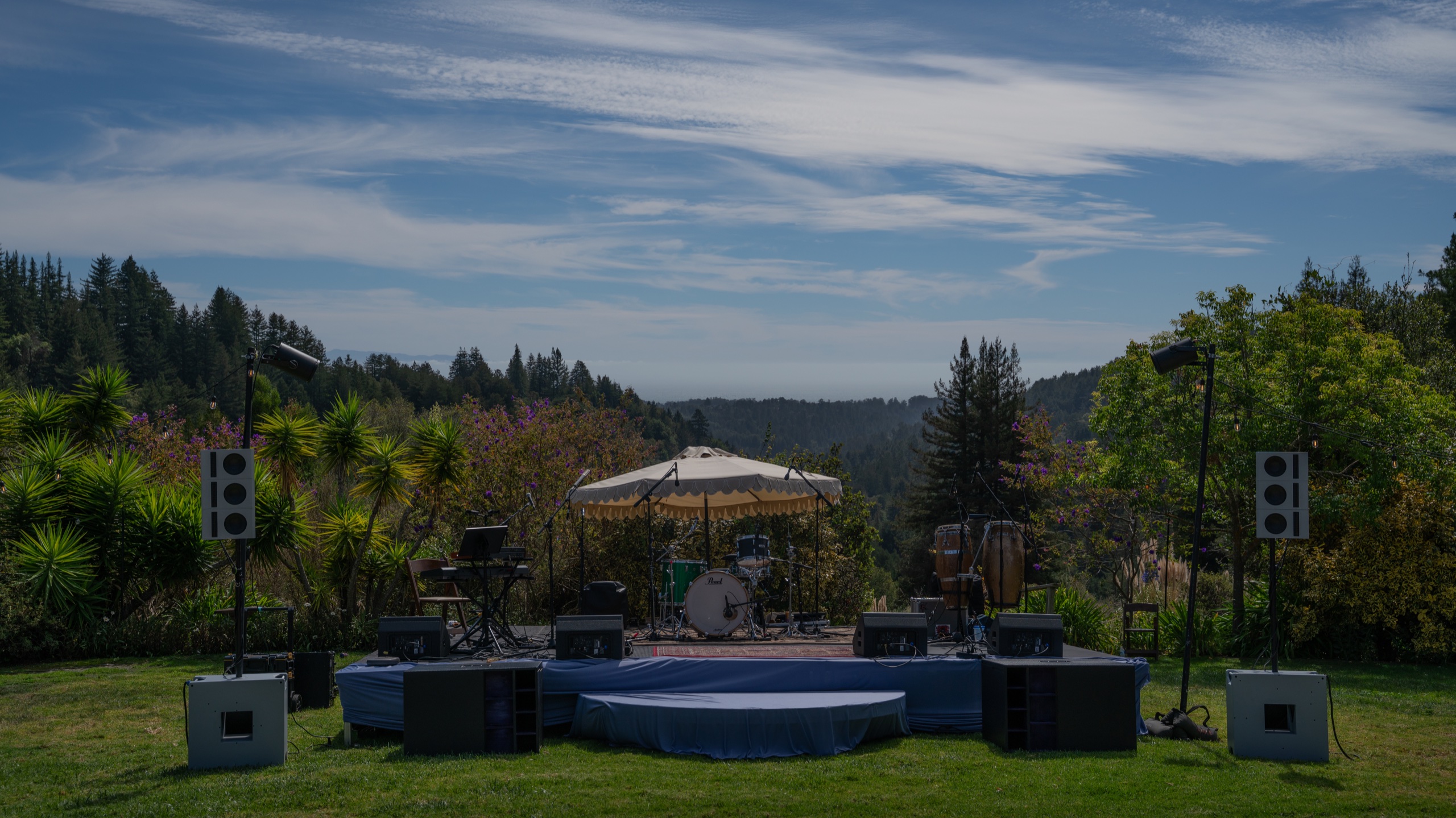 A complete Hi-Tone outdoor stage and sound system overlooking the Santa Cruz Mountains